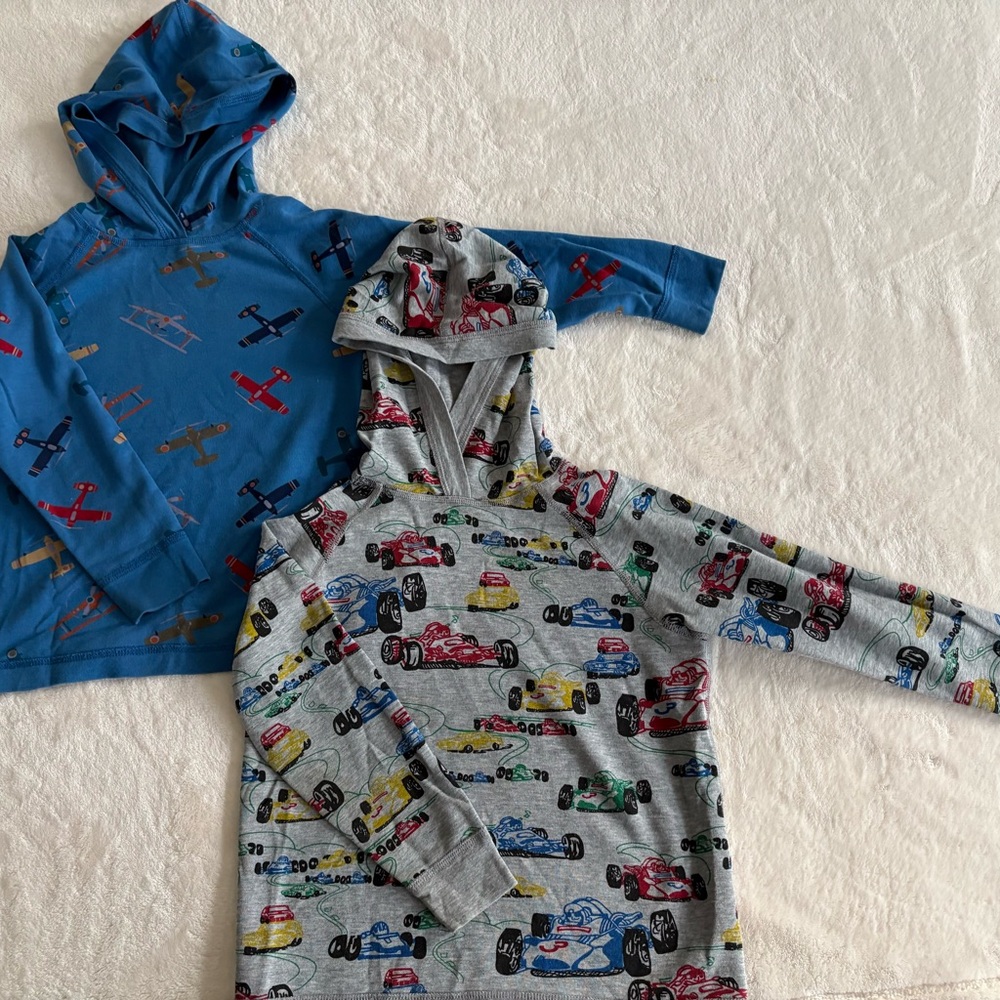 Kids' Hanna Andersson Hooded Long Sleeve Shirts with Car and Airplane Prints.